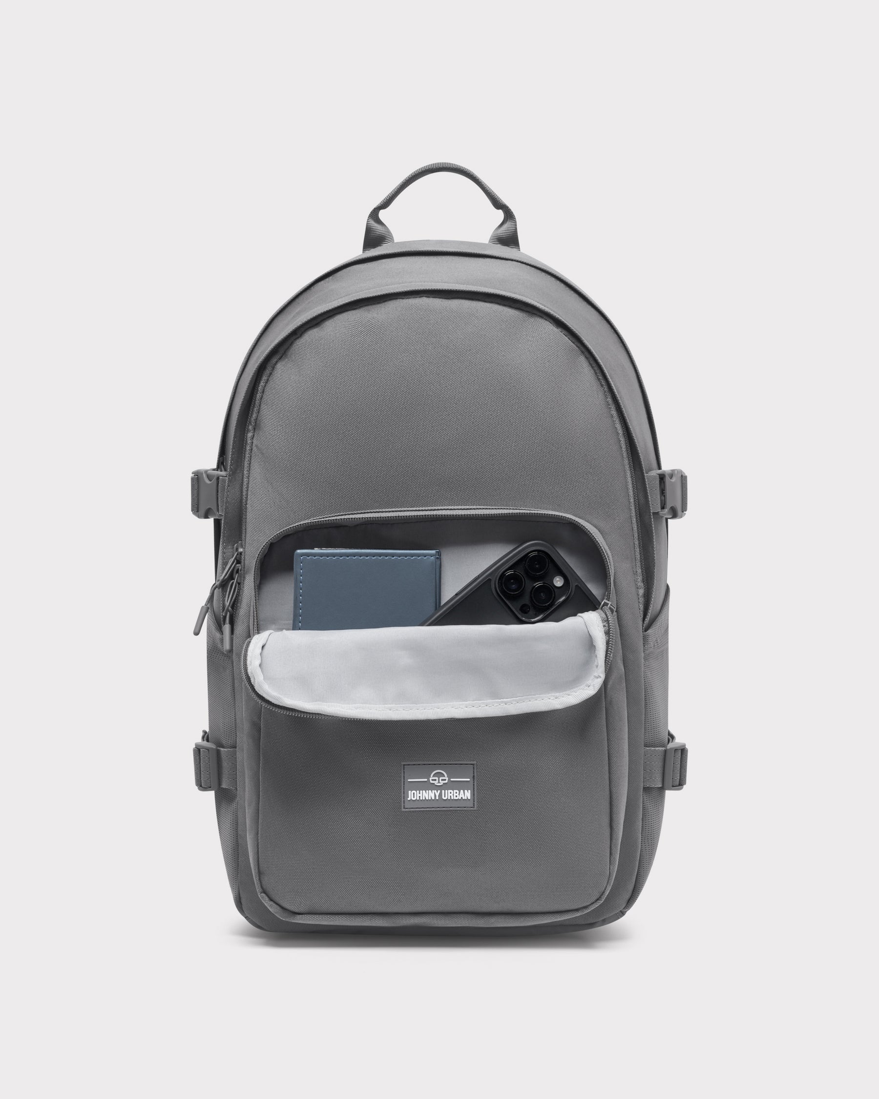 Grauer Johnny Urban Rucksack 'Lian' mit offenem Frontfach, darin ein Smartphone und ein Notizbuch