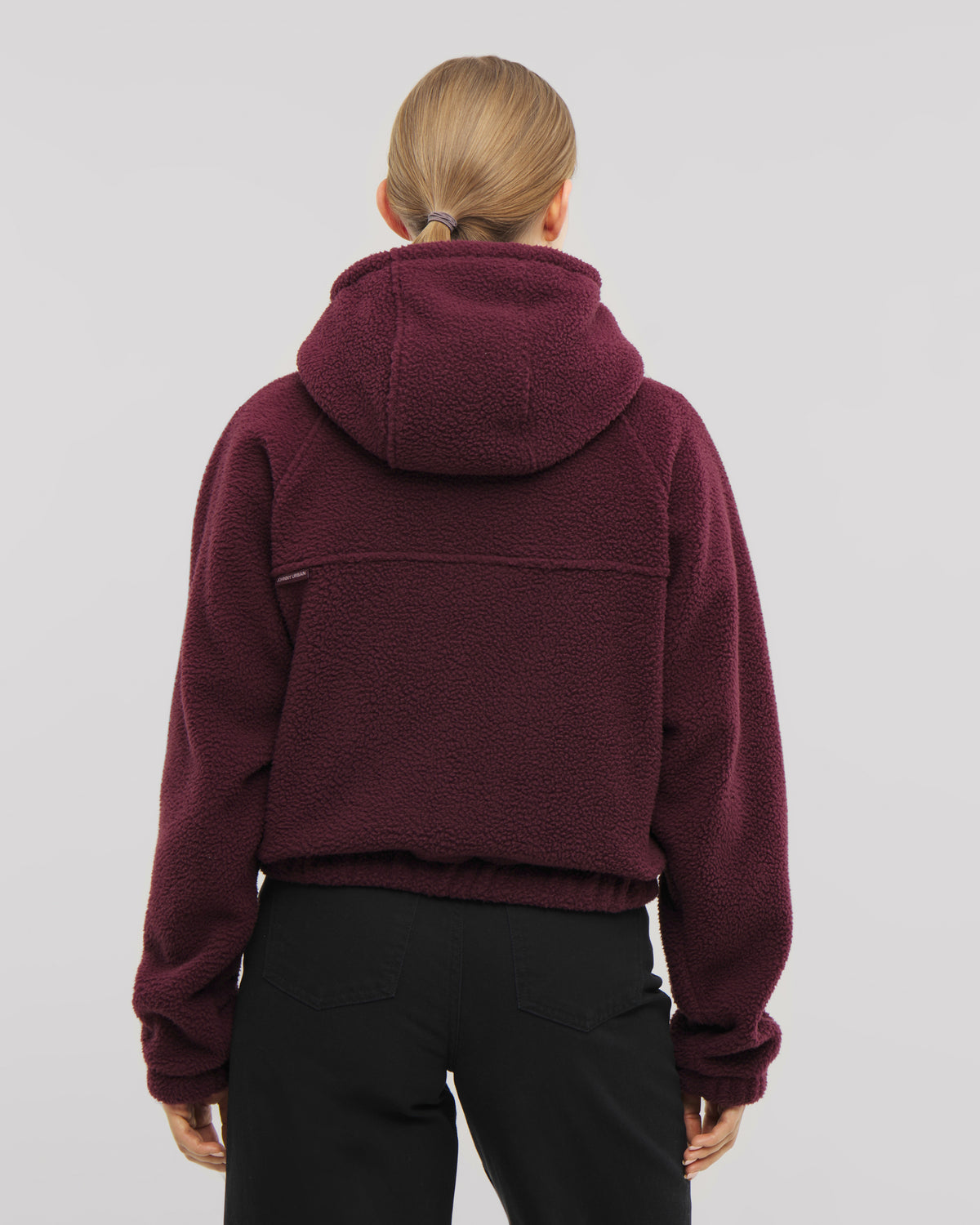 Die Damen Fleecejacke Nova überzeugt durch ihre hohe Kapuze und ihren elastischen Saum. Hier in burgunder-rot. 