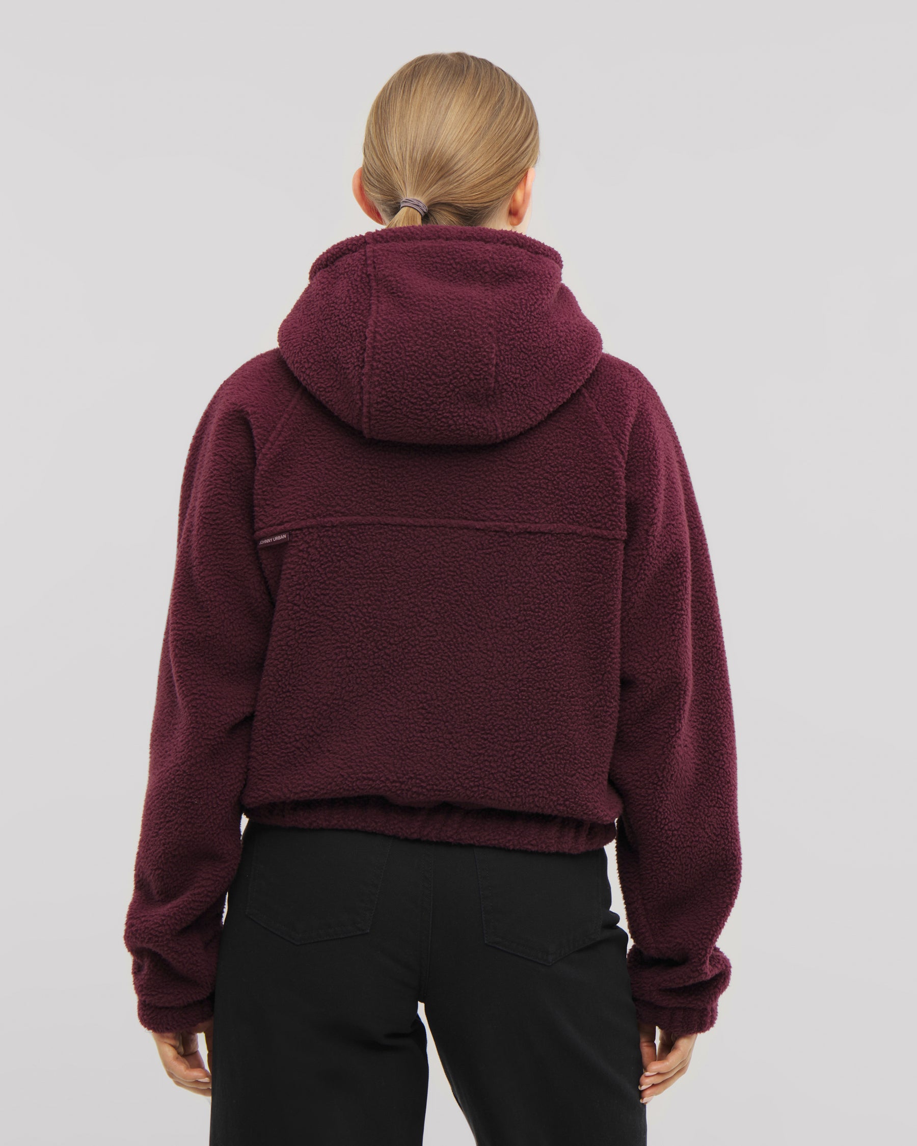 Die Damen Fleecejacke Nova überzeugt durch ihre hohe Kapuze und ihren elastischen Saum. Hier in burgunder-rot. 