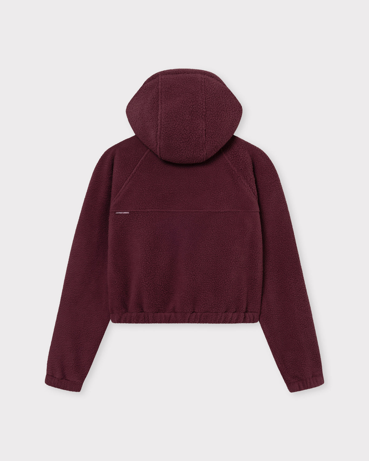 Die Rückseite unserer cropped Fleecejacke Nova bietet dir einem weichem Saum und entspannten Tragekomfort. 