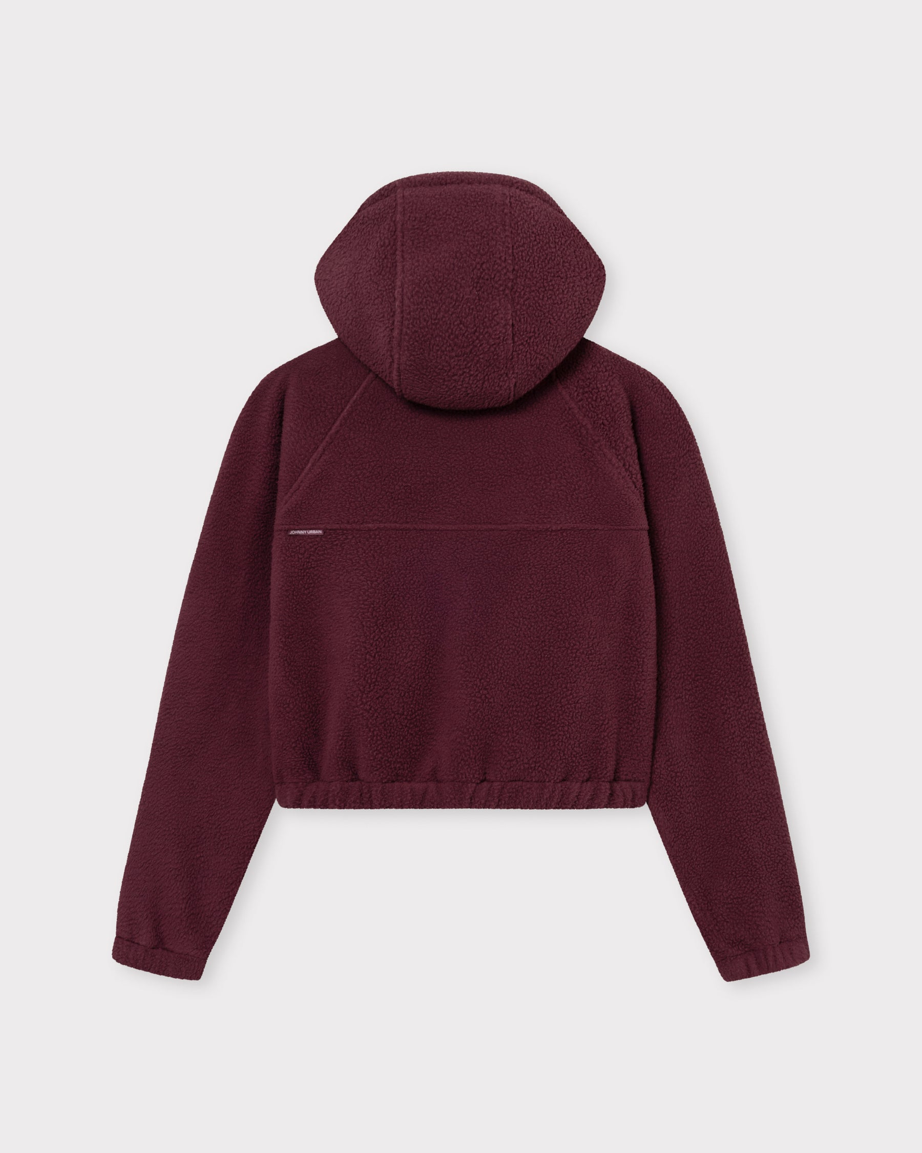 Die Rückseite unserer cropped Fleecejacke Nova bietet dir einem weichem Saum und entspannten Tragekomfort. 