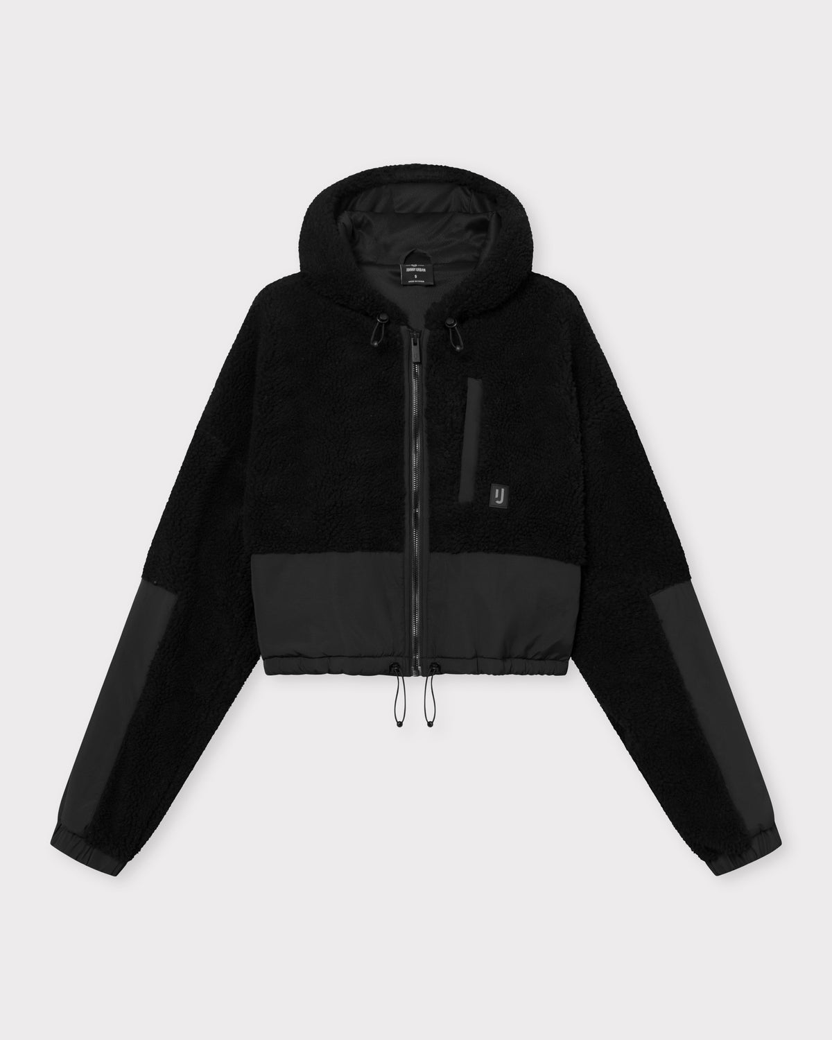Schwarze, kurz geschnittene Teddy-Fleecejacke 'Carey' mit Reißverschluss, Kapuze und elastischem Saum