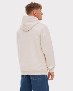 Mann trägt Oversized Hoodie 'Cody' in heller Farbe, Rückansicht