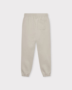 Beige Jogginghose "Owen" unisex mit elastischem Bund und elastischen Bündchen, mit einer Tasche hinten rechts