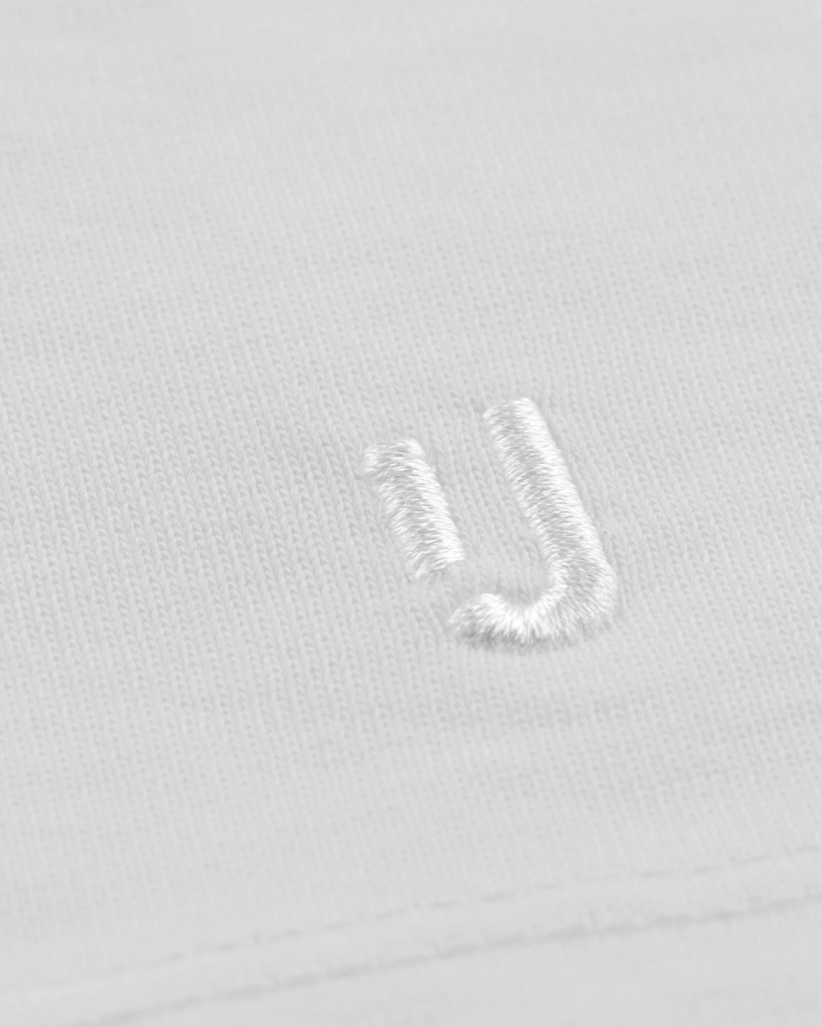 Weiße unisex Oversized-T-Shirt 'Sammy' von Johnny Urban mit weißem Sticklogo