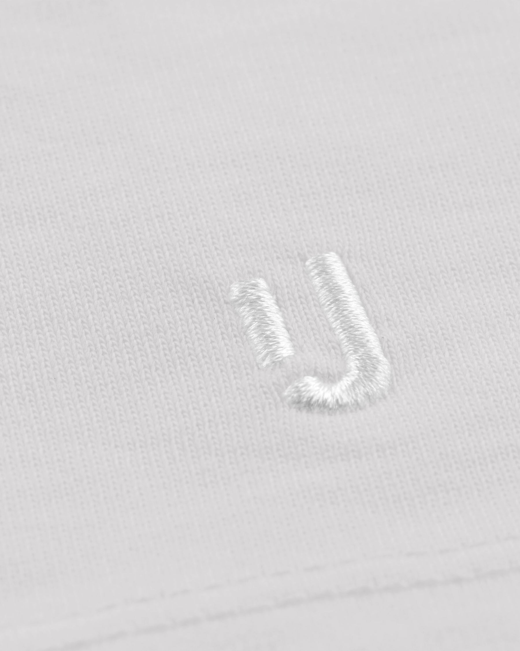 Weiße unisex Oversized-T-Shirt 'Sammy' von Johnny Urban mit weißem Sticklogo