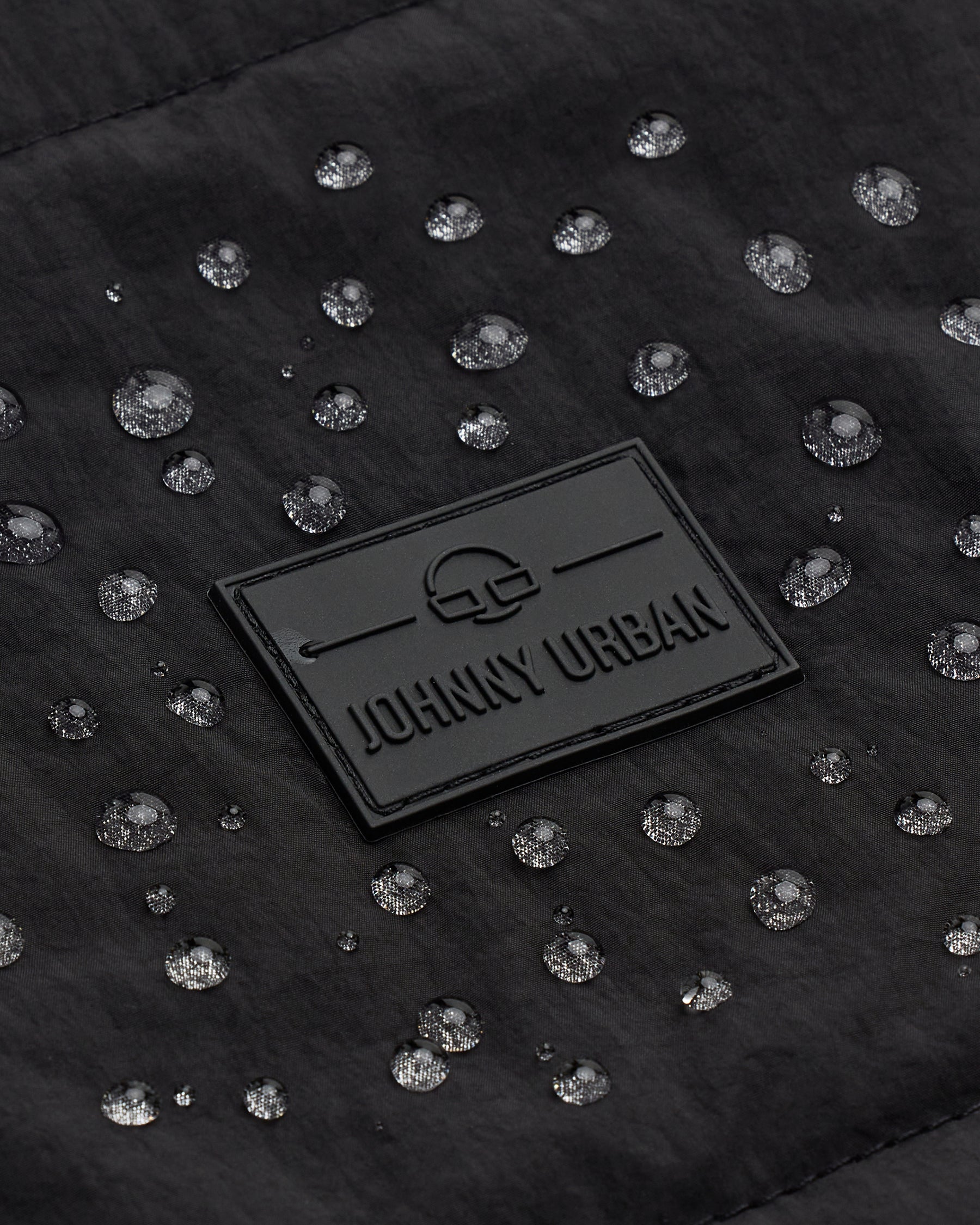 Wasserabweisendes gestepptes Material mit Johnny Urban Logo auf dem Rolltop Rucksack Kyle