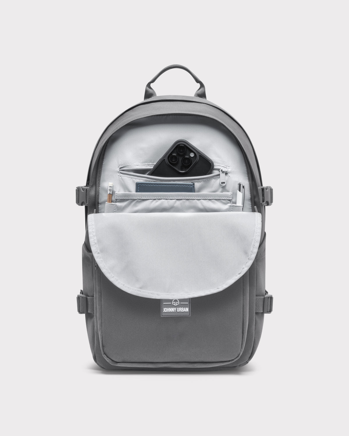 Ergonomischer Johnny Urban Rucksack 'Lian' in Dunkelgrau mit geöffneter Vordertasche und Smartphone, Stift und Notizbuch darin