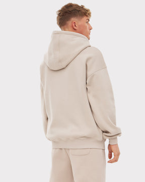 Mann trägt oversized Zip-Hoodie 'Caleb' in Beige von Johnny Urban, Rückansicht