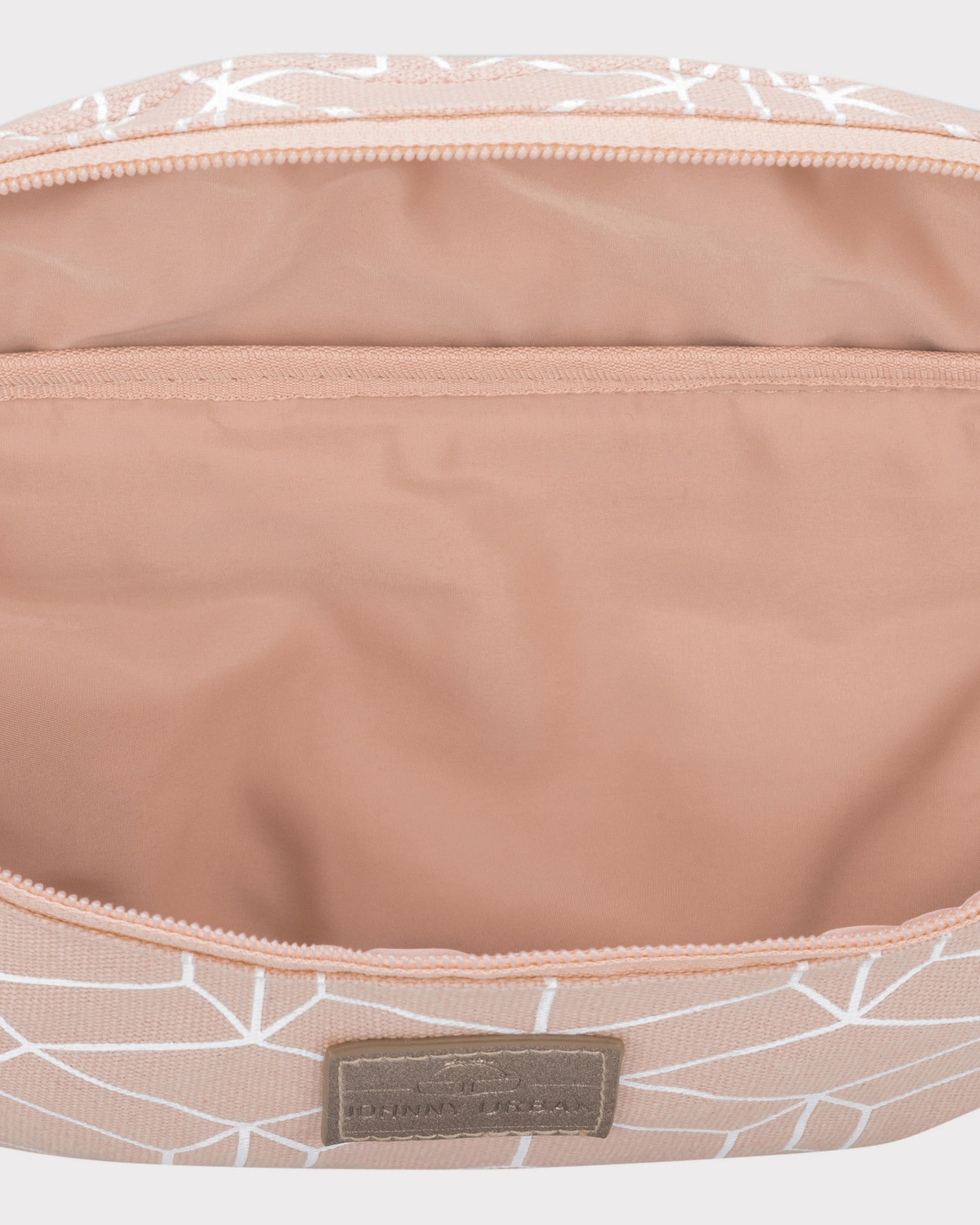 Innenseite der Bauchtasche 'Toni' aus rosa Canvas mit weißem Muster und einem kleinen Innenfach