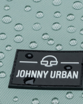 Wasserabweisender mintfarbener Stoff mit Johnny Urban Logo aus schwarzem Material und weißen Buchstaben